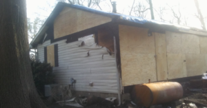 Boarded up home by Modern Remodeling Maryland after house fire