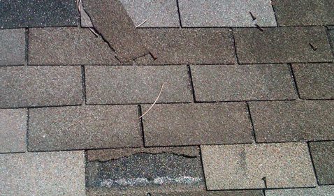Photo of Damage to Shingles caused by wind